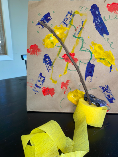 bag with paint and streamers on side.